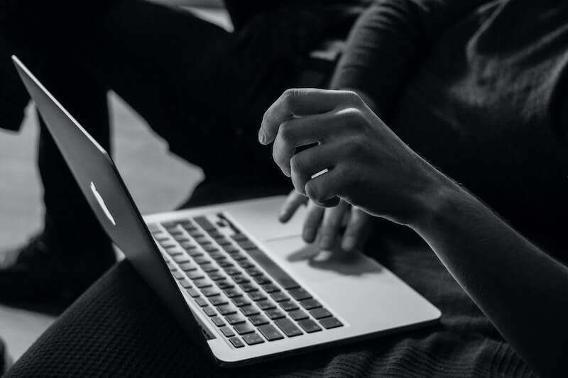 person typing on laptop